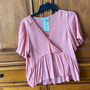 Melon colored peplum top